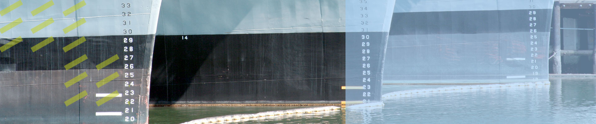 background image of three navy ship hulls docked in a row