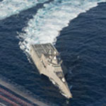 Navy ship in motion on the open ocean